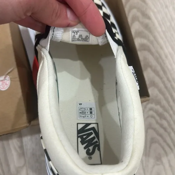 Vans Black and White Checkerboard Slip-On Sneakers