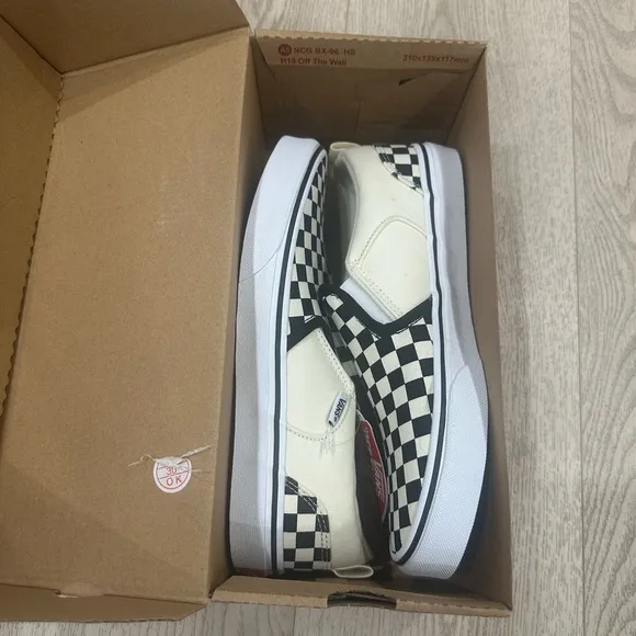 Vans Black and White Checkerboard Slip-On Sneakers