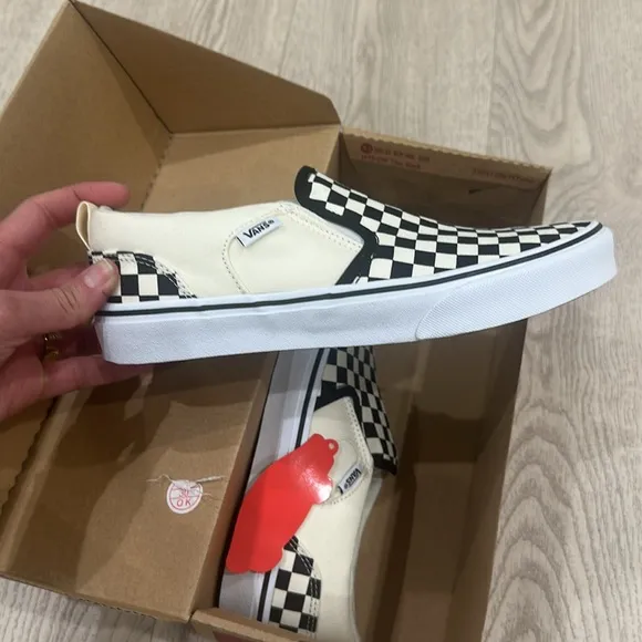 Vans Black and White Checkerboard Slip-On Sneakers