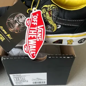 Vans Black and Yellow Sneakers with Iconic Waffle Sole